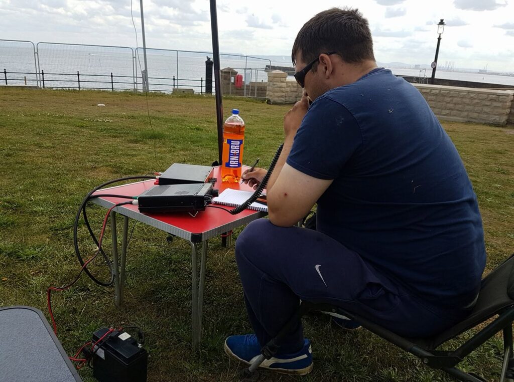 Club chairman Tom 2E0TNT enjoying the sunshine on the town moor during a portable operating evening